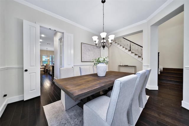 182 River Wilde Dr, Montgomery, TX 77316 - dining room with stairs, a chandelier, dark wood-type flooring, crown molding, and baseboards