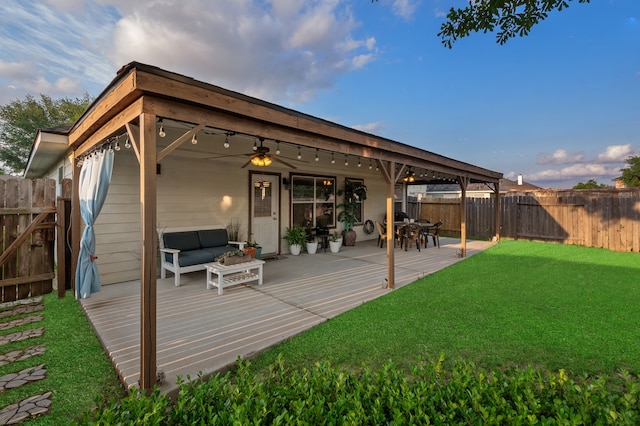 19515 Buckland Park Dr, Katy, TX 77449 - exterior space featuring a fenced backyard, outdoor lounge area, a yard, and a ceiling fan