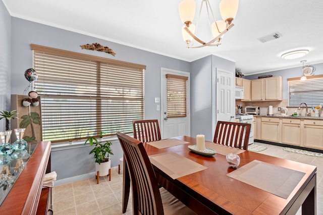 19515 Buckland Park Dr, Katy, TX 77449 - dining area featuring crown molding, a chandelier, a toaster, baseboards, and visible vents