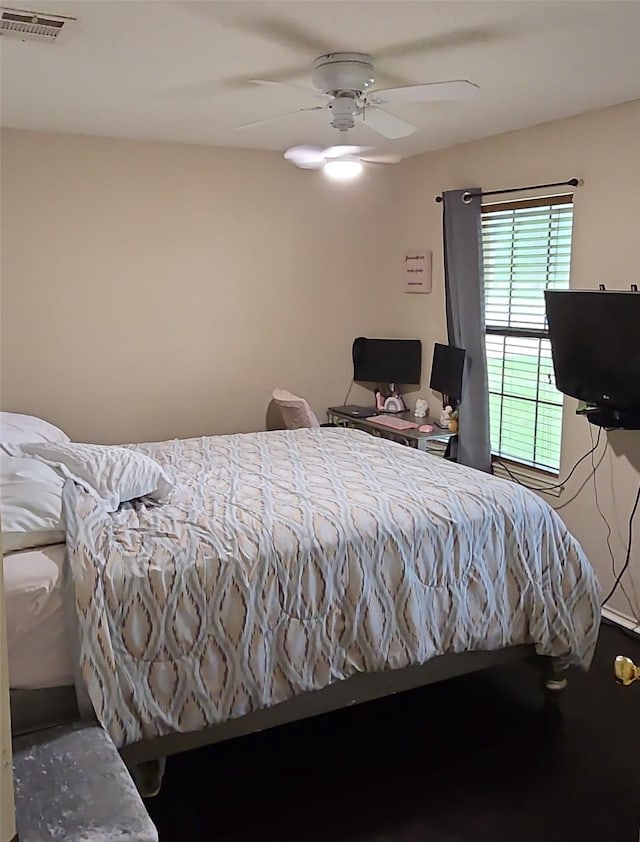 bedroom featuring visible vents and ceiling fan