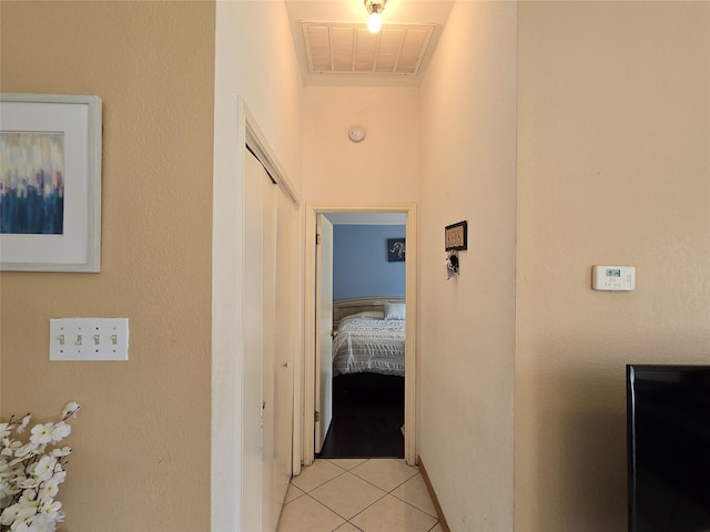 hall with light tile patterned floors and visible vents