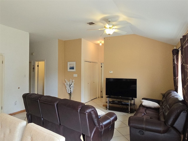 living room with visible vents, a ceiling fan, light tile patterned floors, and vaulted ceiling
