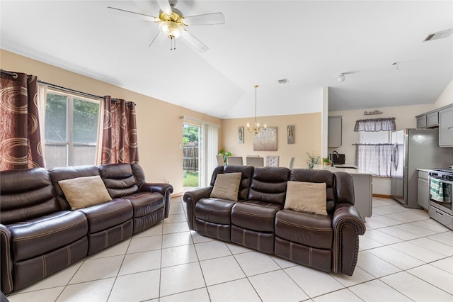 2403 Lendall Ln, Austin, TX 78744 - living room with visible vents, ceiling fan with notable chandelier, light tile patterned flooring, and lofted ceiling
