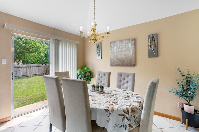 2403 Lendall Ln, Austin, TX 78744 - dining area with baseboards, a notable chandelier, and light tile patterned floors