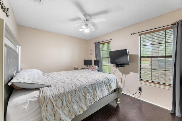 2403 Lendall Ln, Austin, TX 78744 - bedroom featuring baseboards, a ceiling fan, a textured ceiling, and wood finished floors