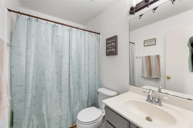 2403 Lendall Ln, Austin, TX 78744 - full bath featuring vanity, a textured ceiling, and toilet