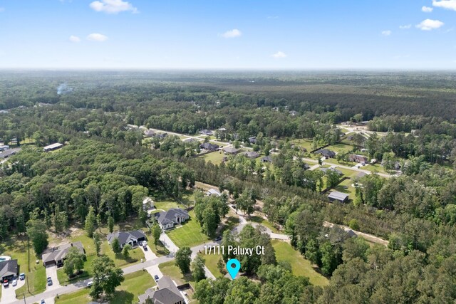 17111 Paluxy Ct, Splendora, TX 77372 - aerial overview of property's location featuring a heavily wooded area and nearby suburban area