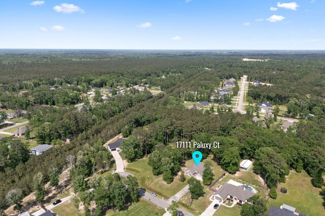 17111 Paluxy Ct, Splendora, TX 77372 - aerial overview of property's location featuring a heavily wooded area