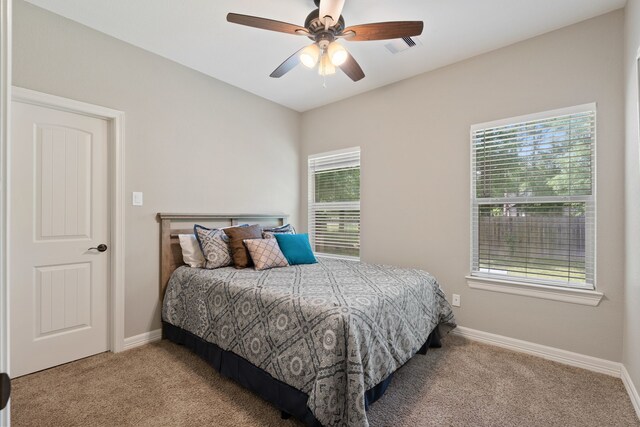 17111 Paluxy Ct, Splendora, TX 77372 - bedroom featuring carpet flooring, baseboards, and a ceiling fan