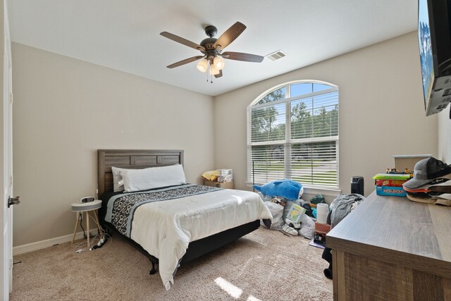 17111 Paluxy Ct, Splendora, TX 77372 - carpeted bedroom with a ceiling fan and baseboards