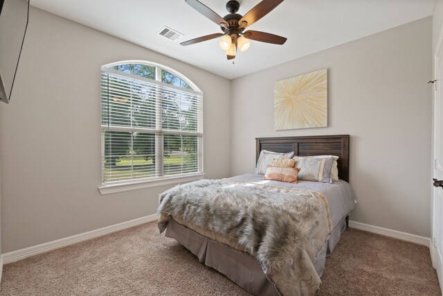 17111 Paluxy Ct, Splendora, TX 77372 - bedroom with carpet flooring, baseboards, and ceiling fan