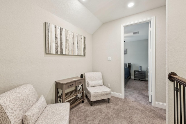 living area with visible vents, baseboards, lofted ceiling, carpet flooring, and recessed lighting