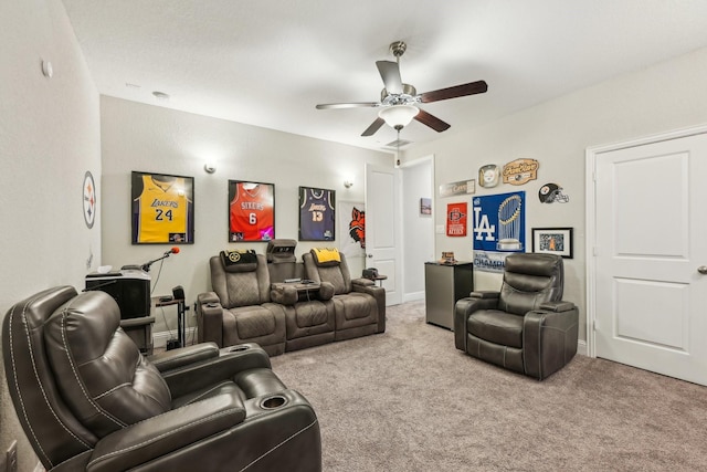 home theater room with carpet and ceiling fan