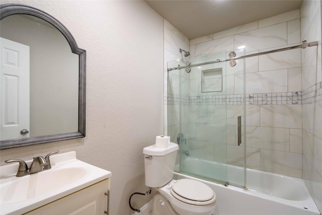 full bath featuring enclosed tub / shower combo, toilet, and vanity