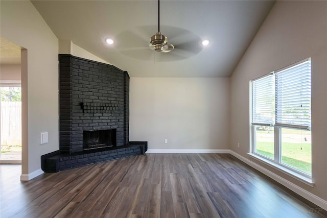 unfurnished living room featuring baseboards, vaulted ceiling, wood finished floors, and a ceiling fan