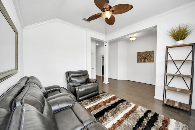 living room featuring vaulted ceiling, wood finished floors, visible vents, crown molding, and ceiling fan