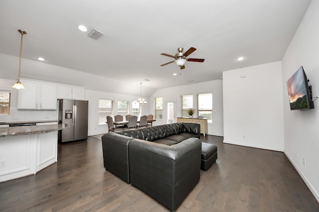 living area featuring recessed lighting, dark wood-style flooring, visible vents, and ceiling fan with notable chandelier
