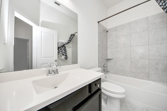 bathroom with visible vents, shower / washtub combination, vanity, and toilet