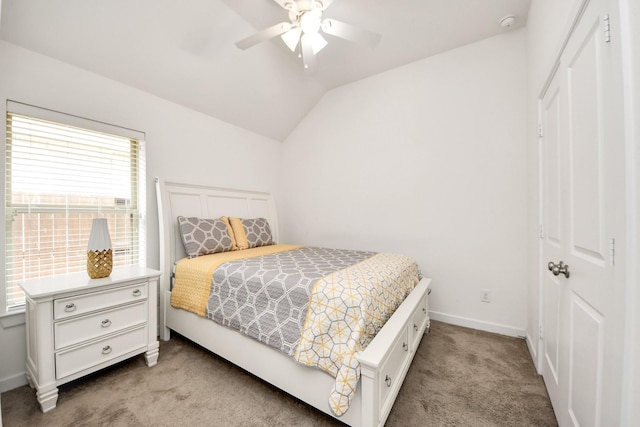 bedroom with baseboards, lofted ceiling, light colored carpet, and a ceiling fan