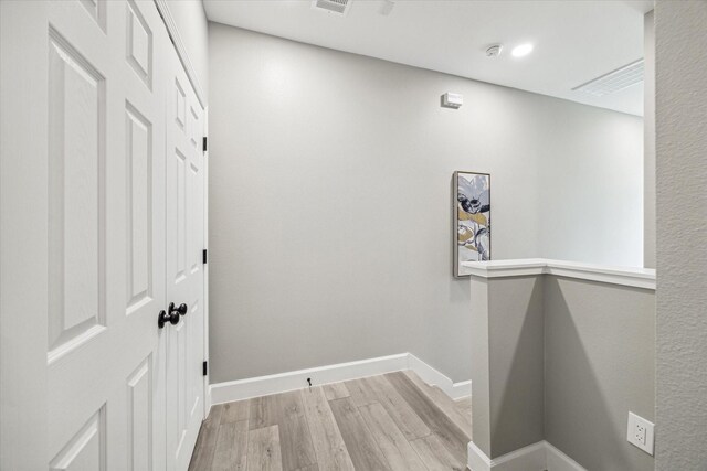 765 Enterprise St Unit C, Houston, TX 77088 - hall featuring baseboards, wood finished floors, and visible vents