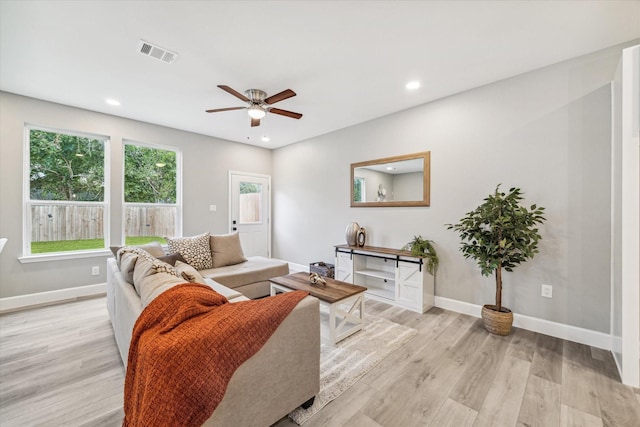 765 Enterprise St Unit C, Houston, TX 77088 - living area featuring light wood-type flooring, baseboards, a ceiling fan, and visible vents