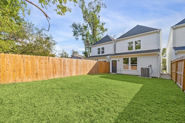 765 Enterprise St Unit C, Houston, TX 77088 - back of property with a lawn, central AC unit, and a fenced backyard