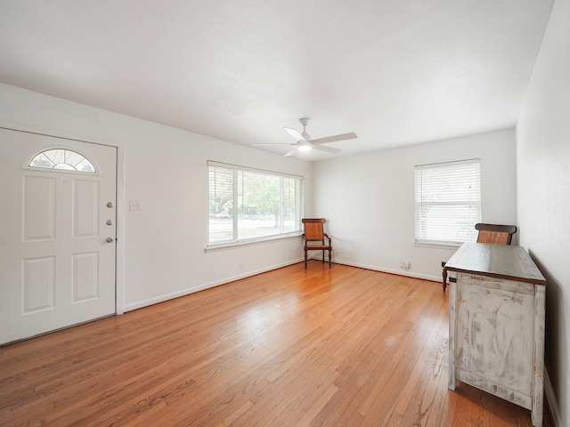 9710 Bassoon Dr, Houston, TX 77025 - foyer entrance featuring ceiling fan, baseboards, and light wood-style floors