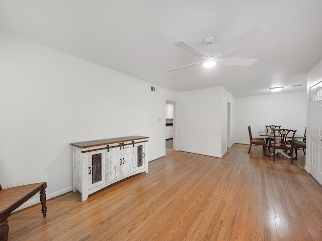 9710 Bassoon Dr, Houston, TX 77025 - interior space with light wood-style floors, visible vents, baseboards, and ceiling fan