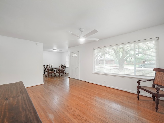 9710 Bassoon Dr, Houston, TX 77025 - interior space with light wood-style floors, a ceiling fan, and baseboards