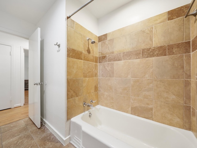 9710 Bassoon Dr, Houston, TX 77025 - bathroom featuring baseboards and shower / tub combination