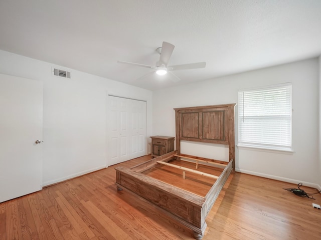 9710 Bassoon Dr, Houston, TX 77025 - bedroom with baseboards, light wood-style flooring, visible vents, and a closet