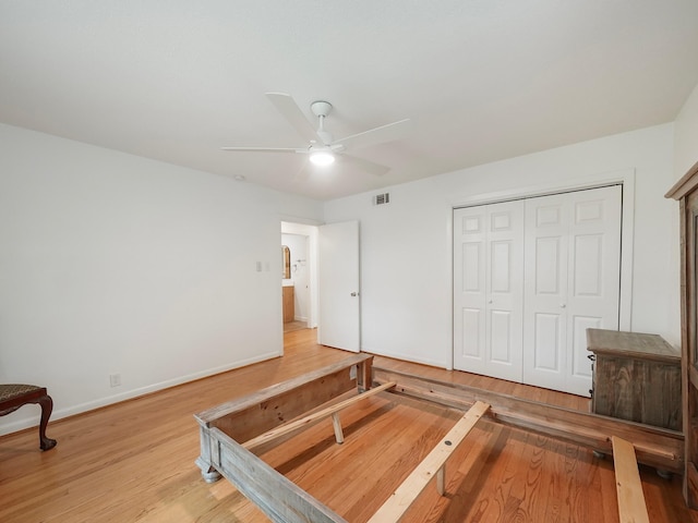9710 Bassoon Dr, Houston, TX 77025 - unfurnished bedroom featuring baseboards, visible vents, wood finished floors, a closet, and ceiling fan