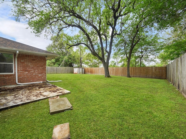 9710 Bassoon Dr, Houston, TX 77025 - view of yard with a fenced backyard, an outbuilding, and a shed