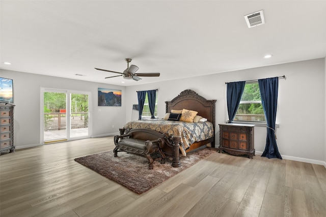 6310 Wickwillow Ln, Alvin, TX 77511 - bedroom featuring wood finished floors, visible vents, access to outside, and multiple windows