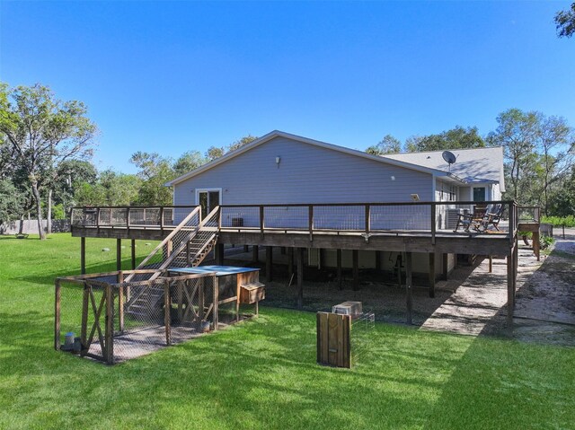 6310 Wickwillow Ln, Alvin, TX 77511 - rear view of property featuring a wooden deck, a yard, and stairs