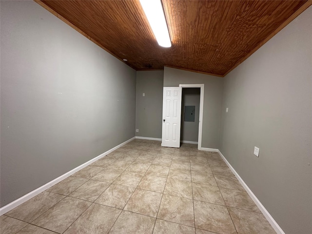 unfurnished room featuring vaulted ceiling, electric panel, wood ceiling, and light tile patterned floors