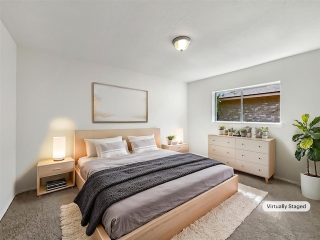 carpeted bedroom with baseboards