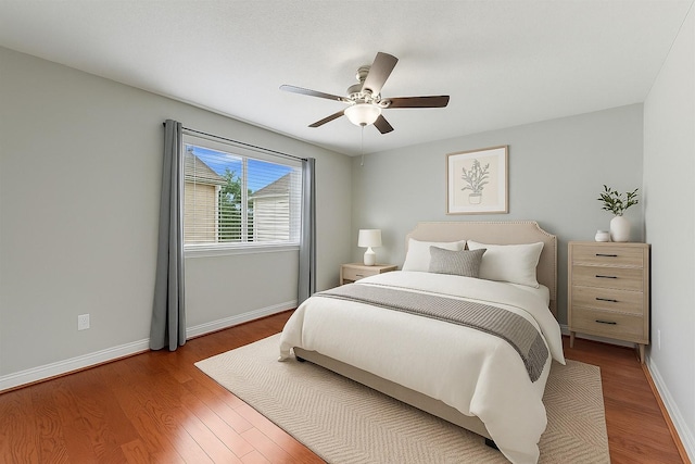 1646 W 13th St, Houston, TX 77008 - bedroom with wood finished floors, baseboards, and ceiling fan
