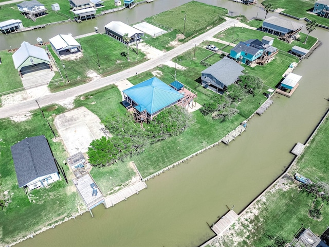 drone / aerial view with a residential view and a water view