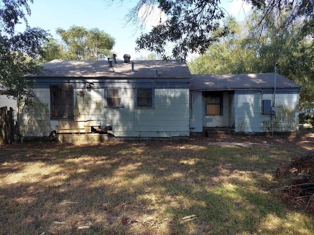 720 Macarthur Ave, Wake Village, TX 75501 - rear view of house featuring a lawn and entry steps