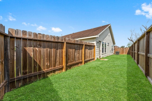 view of yard featuring a fenced backyard and cooling unit