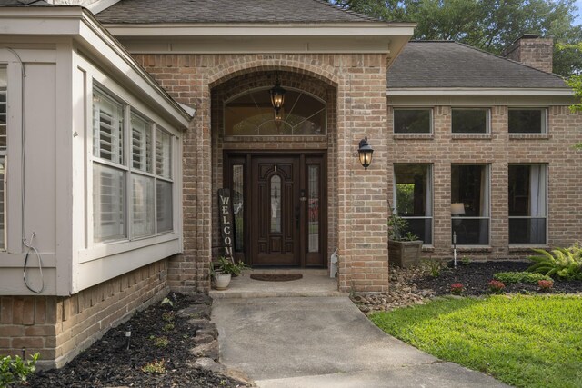 13018 Lentando Ln, Cypress, TX 77429 - entrance to property with a chimney, brick siding, and a shingled roof