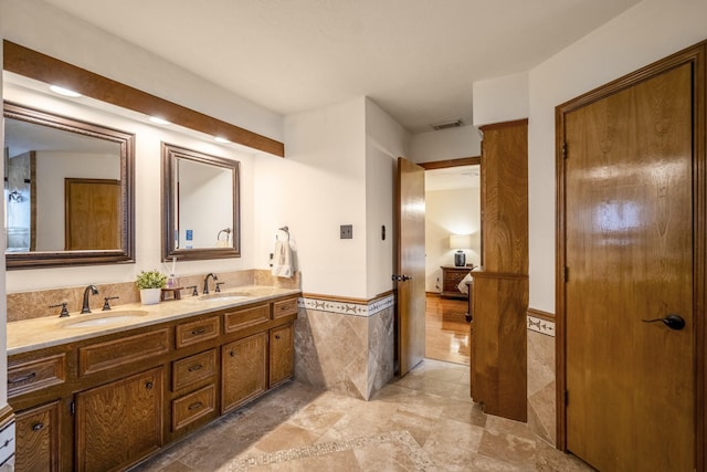 13018 Lentando Ln, Cypress, TX 77429 - full bath with tile walls, a wainscoted wall, and double vanity