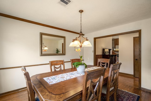 13018 Lentando Ln, Cypress, TX 77429 - dining space featuring wood finished floors, baseboards, and ornamental molding