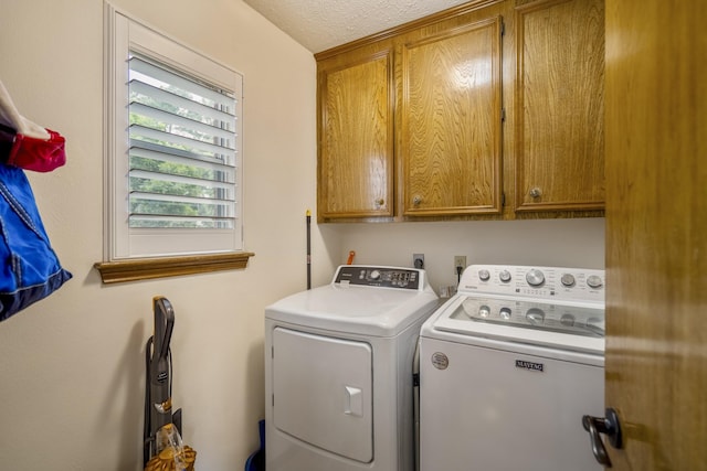 13018 Lentando Ln, Cypress, TX 77429 - washroom with washer and dryer, cabinet space, and a textured ceiling