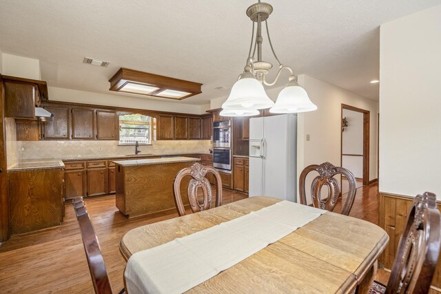 13018 Lentando Ln, Cypress, TX 77429 - dining space featuring light wood-type flooring and recessed lighting