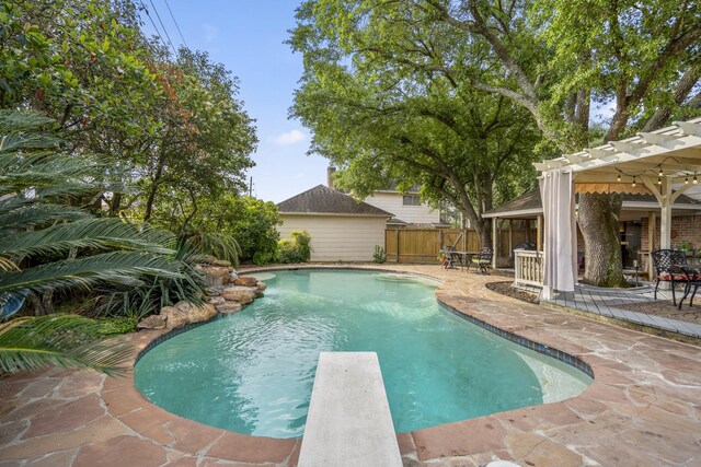 13018 Lentando Ln, Cypress, TX 77429 - view of swimming pool featuring fence, a pergola, a patio area, and a diving board