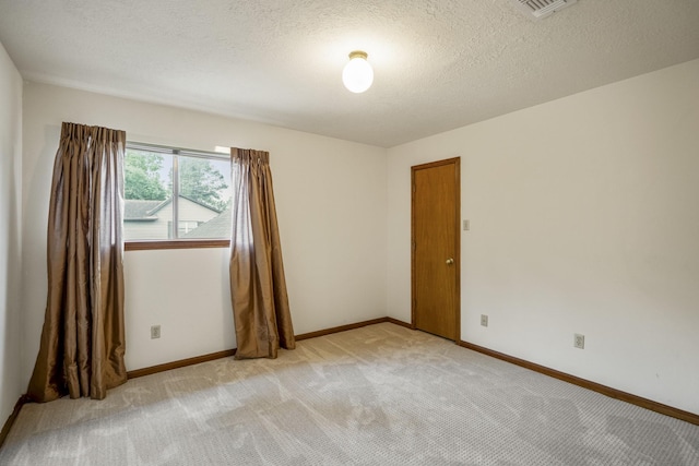 13018 Lentando Ln, Cypress, TX 77429 - unfurnished room featuring light colored carpet, baseboards, and a textured ceiling