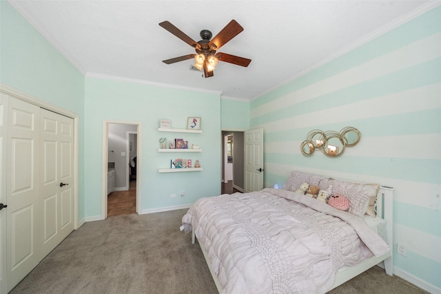 bedroom with carpet flooring, a ceiling fan, a closet, baseboards, and ornamental molding