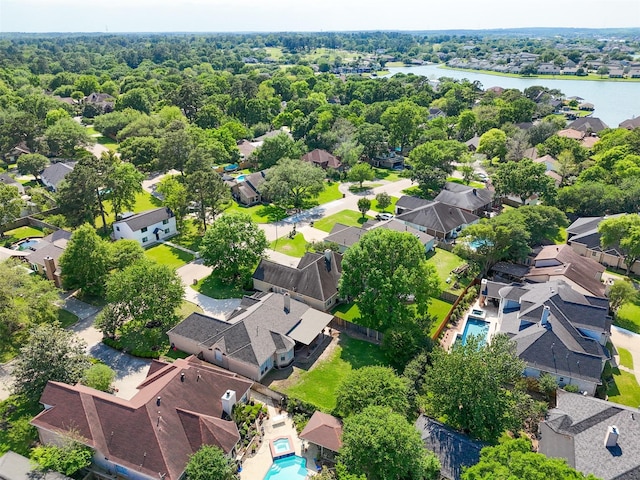 drone / aerial view featuring a water view and a residential view